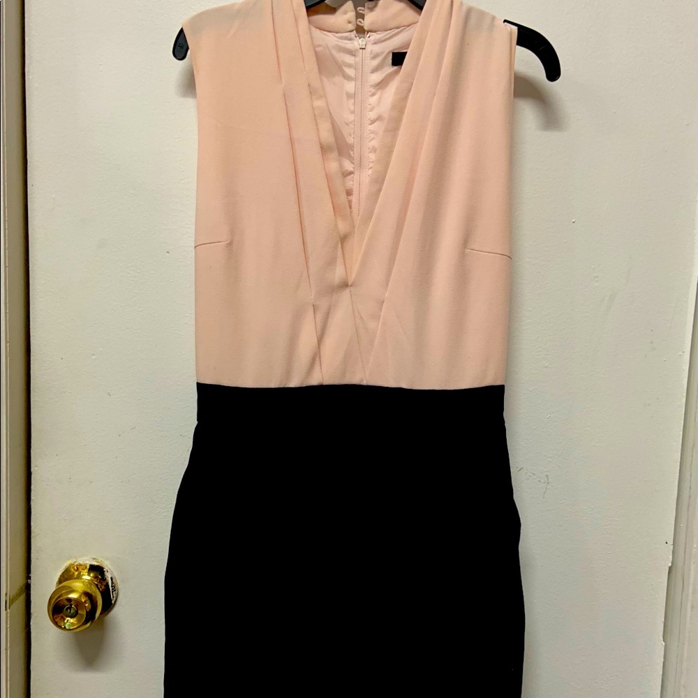Light pink top with navy blue skirt. Skirt has pockets! Zola Brand size Small
